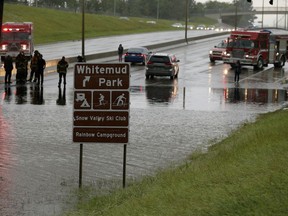 Whitemud Drive under 111 Street in Edmonton had to be closed early Saturday evening as heavy rains in the area caused flooding in the region.