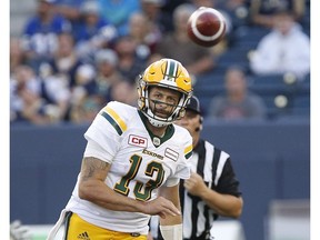 Edmonton Eskimos quarterback Mike Reilly throws a pass during the first half of CFL action against the Winnipeg Blue Bombers in Winnipeg Thursday, July 14, 2016.