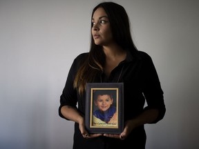 Sage Morin holds a photo of her son Geo Mounsef, 2, who was killed May 19, 2013, when a car driven by Richard Suter crashed into a restaurant patio where the family were dining. On Wednesday, Suter's sentence was increased on appeal from four months to 26 months.