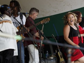 Samantha Martin and Delta Sugar, (right) Black Umfolosi, (left), Daby Touré and Joel Fafard (not shown) perform during Songs of Hope during the Edmonton Folk Music Festival at Gallagher Park in Edmonton, Alberta on Friday, August 5, 2016.