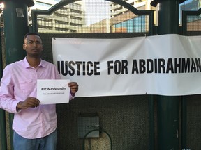 Liban Ali participated Wednesday in a candlelight vigil in Edmonton for Abdirahman Abdi, 37, who died following an altercation with Ottawa police  July 24.