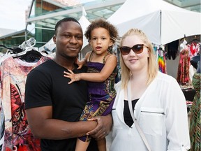 Alfred Kamara and Taylor Farmer pose with their two-year-old daughter, Sophia Kamara-Farmer, during the Cariwest Festival Friday Night Extravaganza.