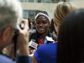 Runner Kendra Clarke of Edmonton speaks to media as Canada's 2016 Rio Olympic Games Track & Field Team is announced at City Hall in Edmonton, on July 11, 2016.