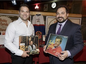 Mike (left) and Chris Curtola, sons of singer Bobby Curtola, pose for a photo during a celebration of the singer's life at the Ranch Roadhouse in Edmonton, Alberta on Tuesday, Aug. 2, 2016.