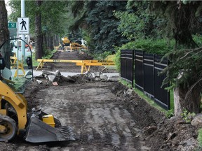 Construction crews putting in a shared-use pathway along 102 Avenue.