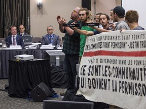 Demonstrators disrupt the National Energy Board public hearing into the proposed $15.7-billion Energy East pipeline project proposed by TransCanada on Aug. 29, 2016 in Montreal.