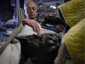 Don Begg, a bronze artist and founder of Studio West, prepares to give a facelift to a statue of hockey great Wayne Gretzky at his foundry in Cochrane, Alta., on Aug. 5, 2016.