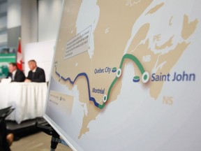 TransCanada's President and Chief Executive Officer Russ Girling, right, and Trans Canada's President of Energy and Oil Pipelines  Alex Pourbaix speak at their company's announcement of an Energy East pipeline project on Aug. 1, 2013.