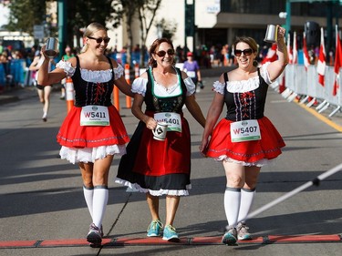 Costumed runners look like they're ready for Octoberfest during the 2016 Edmonton Marathon on Sunday, Aug. 21, 2016.