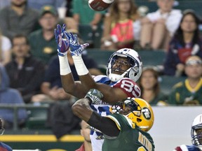 Eskimos CB Patrick Watkins battles Alouettes receiver Duron Carter for the ball during last Thursday's game at Commonwealth Stadium.