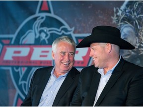 Oilers Entertainment Group vice-chairman and CEO Bob Nicholson laughs Wednesday with Professional Bull Riders CEO Sean Gleason during a press conference announcing a new partnership between the two organizations.