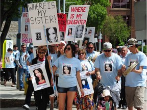 Candice L'Hommecourt leads an awareness walk at Churchill Square in June 2014 for her missing sister, Shelly Dene. Dene went missing from Edmonton in August 2013. There have been no new leads in her case.