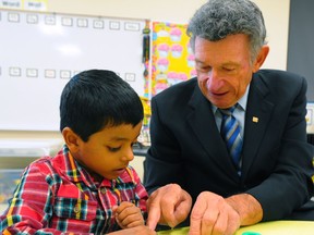 Former Edmonton Public Schools superintendent Michael Strembitsky with student Dihen Amarasinghe at the new K-9 school named for him as it opens for the first time on Sept. 4, 2012.