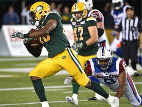 Edmonton Eskimos Deon Lacey (40) makes an interception and runs for a TD with under one minute left to play as Montreal Alouettes Nik Lewis (8) makes a diving effort during CFL action at Commonwealth Stadium in Edmonton Friday, August 11, 2016. Ed Kaiser/Edmonton Journal/Postmedia (Edmonton Journal story by Dan Barnes) Photos for stories, columns off Eskimos game appearing in Friday, Aug. 12 edition.