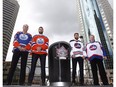 Edmonton Oilers alumnus Dave Semenko, Oilers goaltender Cam Talbot, Winnipeg Jets forward Blake Wheeler and Jets alumnus Thomas Steen show off the Heritage Classic jerseys as the National Hockey League announce the rosters at a Tim Hortons NHL Heritage Classic press event at Winnipeg's Portage and Main intersection on Friday, August 5, 2016.