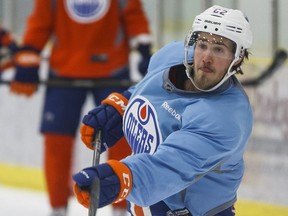 Edmonton's Eric Gryba fires a slapshot during an Edmonton Oilers practice at Leduc Recreation Centre in Leduc, Alta., on Monday March 21, 2016 ahead of a March 22 game against the Arizona Coyotes. Photo by Ian Kucerak