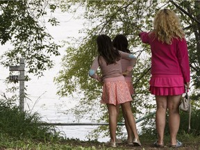 Edmontonians check out high levels in the North Saskatchewan River in Edmonton, Alberta on Thursday, August 25, 2016. The City of Edmonton says river levels have crested.