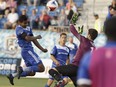 Edmonton's Shamit Shome (26) heads the ball during NASL soccer play between FC Edmonton and the New York Cosmos at Clarke Stadium in Edmonton on July 27, 2016.
