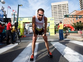 Edmonton's Tom McGrath finishes the half marathon during the 2016 Edmonton Marathon in Edmonton, Alta., on Sunday, Aug. 21, 2016.