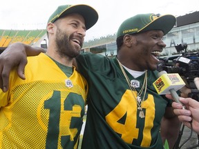 Mike Reilly (13) and Odell Willis (41) answer questions during a media scrum following an Edmonton Eskimos practice at Commonwealth Stadium, in Edmonton on Friday June 24, 2016. Photo by David Bloom