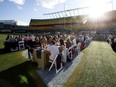 Approximately 400 people enjoy dinner on Commonwealth Field during Feast on the Field, in Edmonton on Wednesday Aug. 17, 2016. Photo by David Bloom