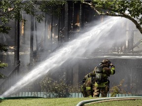 Firefighters battle a condo fire in Mill Woods on Friday August 12, 2016.