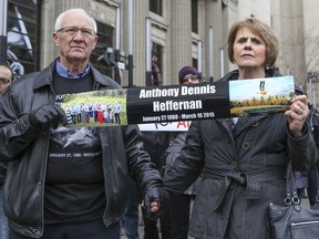 Patrick and Irene Heffernan, Anthony Heffernan's parents, hold a banner at a Caglary rally in April of 2015.