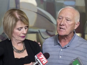 Parents Pat, right, and Irene Heffernan react after an ASIRT (Alberta Serious Indicent Response Team) and Alberta Crown Prosecution Service press conference into the 2015 Calgary police shooting of their son Anthony Heffernan in Calgary on Monday, Aug. 22, 2016.