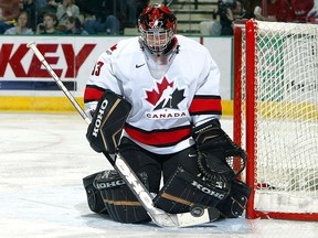Goalie Jeff Glass of Team Canada makes a save against Team Sweden during the World Jr. Hockey tournament on December 27, 2004, at the Ralph Englestad Arena in Grand Forks, North Dakota.