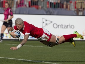 Canada's captain Jen Kish dives over to score in Canada's 55-7 win over USA in the women's rugby sevens gold medal game at the 2015 Pan Am games in Toronto on Sunday, July 12, 2015.