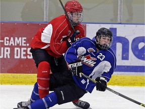 Jude Butler (left) collides with Chase Mameth (right) during an Edmonton Oil Kings training camp scrimmage game at the Dow Centennial Centre in Fort Saskatchewan, Alta., on August 29, 2016.