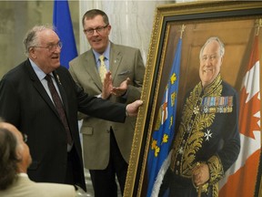 The official portrait of Colonel (Ret'd) The Honourable Donald S. Ethell (left), former Lieutenant Governor of Alberta, is unveiled during a ceremony at the Alberta Legislature, in Edmonton on Monday Aug. 15, 2016. Photo by David Bloom