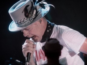 Lead singer Gord Downie is seen performing on a screen during a viewing party in Vancouver for the final stop of a 10-city national concert tour by The Tragically Hip on  August 20, 2016.