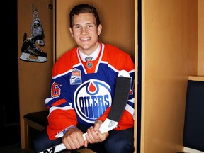 Matthew Cairns seems happy enough to pose wearing his new Edmonton Oilers sweater.