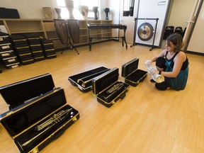 Music teacher Julie Scott unwraps brand new instruments in St. John XXIII, a K – 9 school in Windermere, in August 2016.