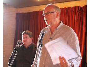 Oilers Entertainment Group vice-president of operations Stu Ballantyne (left) listens as Jon Hall of the 104 Street Committee addresses a group gathered at Stage 104 on Wed., Aug. 10, to hear updates about the downtown arena and what it will mean for local businesses.