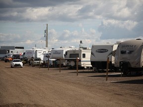 One of the rows of RVs parked at the Abram's Landing campsite at the top of Fort McMurray's Dickensfield neighbourhood on August 23, 2016. The grounds were set up with water and electricity to allow displaced resident to park while they wait for more permanent housing solutions.
