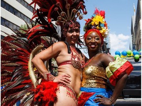 People take part during the Cariwest Festival's Great Parade along Jasper Avenue in Edmonton, Alta., on Saturday, Aug. 6, 2016.