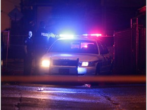 Police investigate the scene of a shooting near 85 Street 111 Avenue  in Edmonton, Alta. on Tuesday, August 9, 2016. DAVID BLOOM / Postmedia