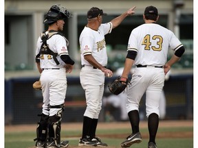 The Edmonton Prospects' Paul Richy (43) is pulled by head coach Ray Brown in the 6th inning against the Medicine Hat Mavericks during Game 4 of  the WMBL playoff series at the former Telus Field, in Edmonton on Monday Aug. 8, 2016. Catcher Logan Wedgewood is pictured left. The Prospects lost the opening game of the WMBL final 3-0 to Swift Current on Thursday.