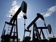 Pumpjacks pump crude oil near Halkirk, Alta., June 20, 2007 .A flurry of stock sale financings by oil and gas producers in Canada has sparked optimism among investors that the stalled drilling industry will soon go back to work. But analysts warn that's not likely to happen this year,