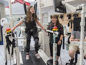 Robotic gait training can replace traditional physical therapy for helping improve the walking abilities of children with cerebral palsy. Maggie Slessor, an 11-year-old with cerebral palsy, demonstrated the Lokomat at the Glenrose Rehabilitation Hospital on August 9, 2016. Maggie shares a laugh with physiotherapist Kelsey Switzer.