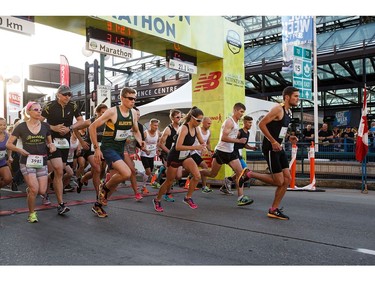 Runners break away from the starting line for the  10k run during the Edmonton Marathon on Sunday, Aug. 21, 2016.