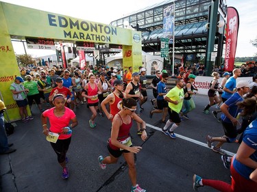 Runners leave the start line of the half-marathon on Sunday, Aug. 21, 2016.