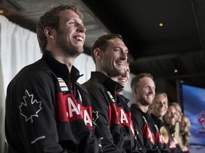 Members of the four teams to represent Canada in Beach Volleyball at the Rio 2016 Olympic Games (left to right Sam Schachter, Josh Binstock, Ben Saxton, Chaim Schalk, Kristina Valjas, Jamie Broder, Sarah Pavan and Heather Bansley) are pictured at the Canadian Olympic Committee's press availability for the athletes held in a Toronto restaurant on July 20, 2016 .