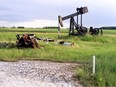 Abandoned oil well equipment, once owned by now company, marks the almost 23-acre site on a farm near Legal which was being cleaned up in 2009 by the Orphan Well Association.