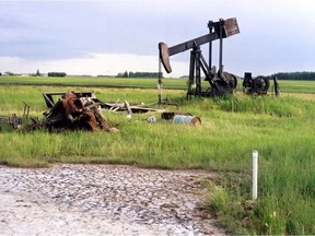 Abandoned oil well equipment, once owned by now company, marks the almost 23-acre site on a farm near Legal which was being cleaned up in 2009 by the Orphan Well Association.