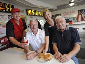 Jack Clarke (sitting/right) of Jack's Drive-In in Spruce Grove celebrates his 80th birthday at the restaurant this weekend. Also pictured are co-founder Larry Campbell (sitting left) and current owners Steve and Mandy Kenworthy.