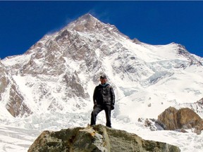 Stuart Erskine pictured with K2 in the background. Erskine and a team of climbers have been forced to cancel their summit attempt after a massive avalanche destroyed equipment stored at Camp 3 and Camp 4.