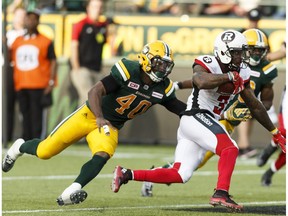 Edmonton's Deon Lacey (40) chases Ottawa's Travon Van (3) during a CFL game between the Edmonton Eskimos and the Ottawa Redblacks at the Brick Field at Commonwealth Stadium in Edmonton on Saturday, June 25, 2016. The Eskimos are in Ottawa to face the Redblacks on Saturday.